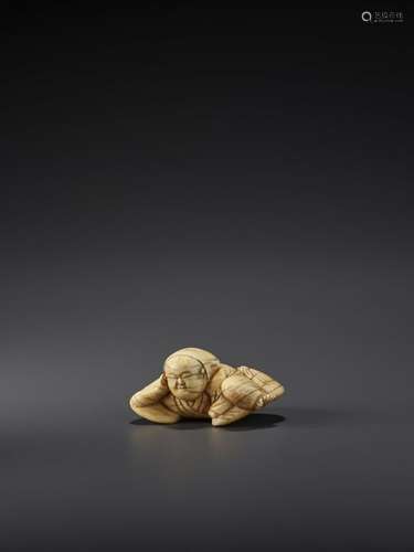 AN IVORY NETSUKE OF A SLEEPING MAN