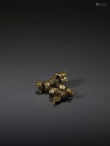 A SHISHI BRONZE SCROLL WEIGHT