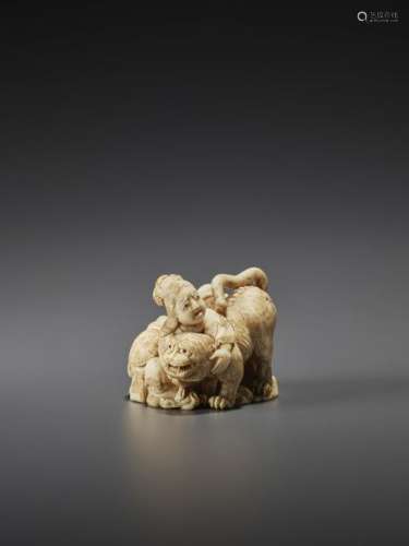 AN IVORY NETSUKE OF A MAN AND WOMAN WITH TIGER BY …