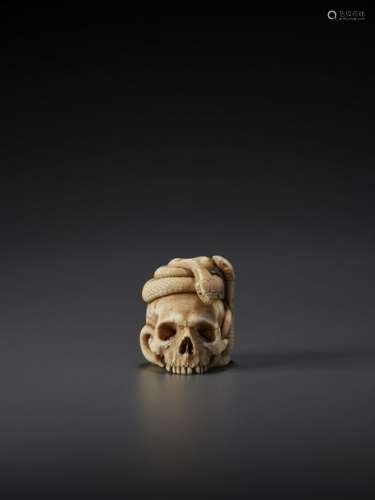 AN EXCELLENT IVORY NETSUKE OF A SKULL WITH SNAKES