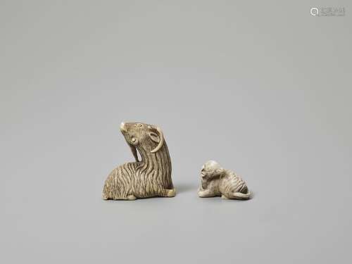 TWO IVORY NETSUKE OF GOATS