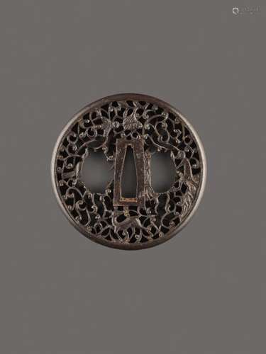 AN IRON TSUBA WITH MONKEY, LOTUS AND DEER