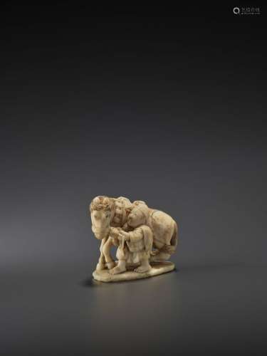 AN IVORY NETSUKE OF A HORSE AND GROOM BY TOYOSAI T…
