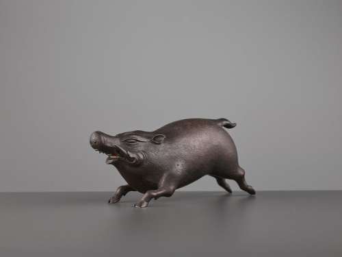 A FINE BRONZE OF A RUNNING BOAR