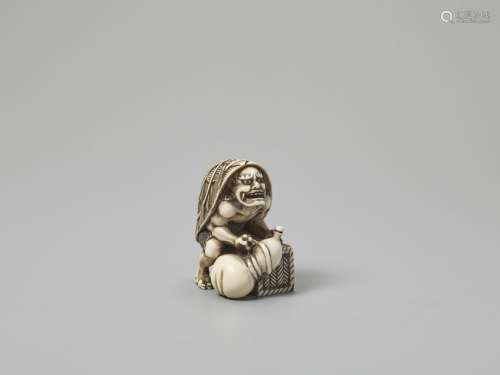 AN IVORY NETSUKE OF AN ONI WITH LARGE GOURD AND ST…