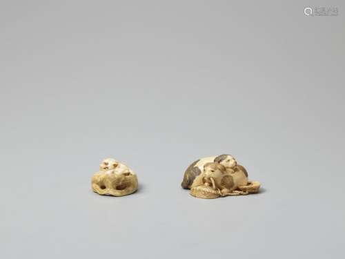 TWO IVORY NETSUKE OF TIGERS AND DOGS