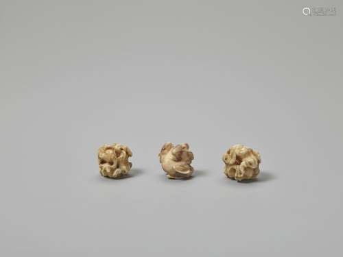 THREE MINIATUTE IVORY CARVINGS OF RABBITS AND FROG…