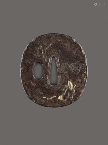 A FINE IRON TSUBA WITH SARUMAWASHI