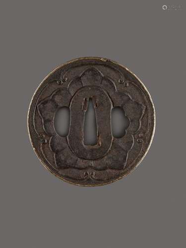 AN IRON TSUBA WITH MON CREST