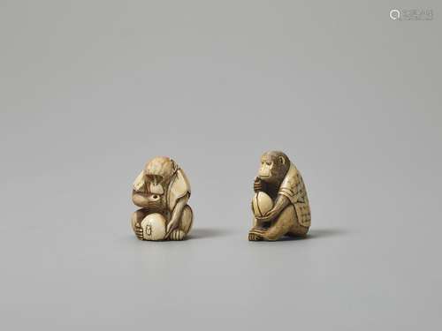 TWO IVORY NETSUKE OF MONKEYS LOOKING AT BUGS