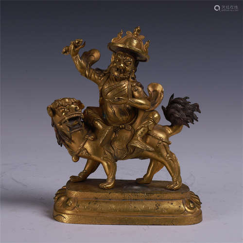 TIBETAN GILT BRONZE BUDDHIST GUARDIAN ON LION