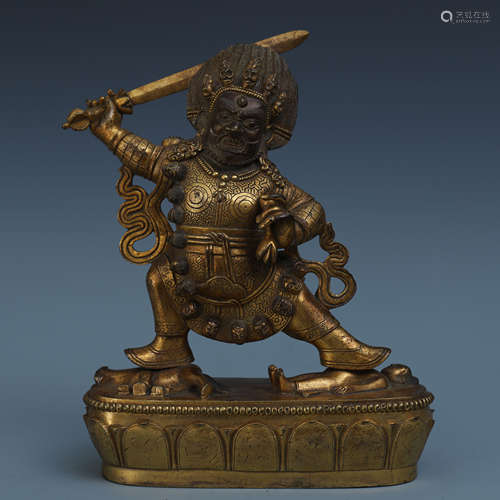 TIBETAN GILT BRONZE STANDING BUDDHIST GUARDIAN