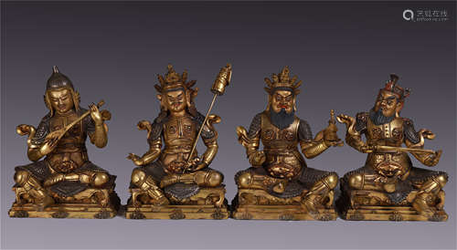 CHINESE GILT BRONZE SEATED FOUR HEAVENLY KINGS WITH WEAPONS