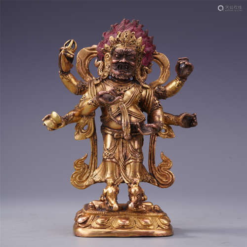 TIBETAN GILT BRONZE STANDING FOUR ARM BUDDHIST GUARDIAN