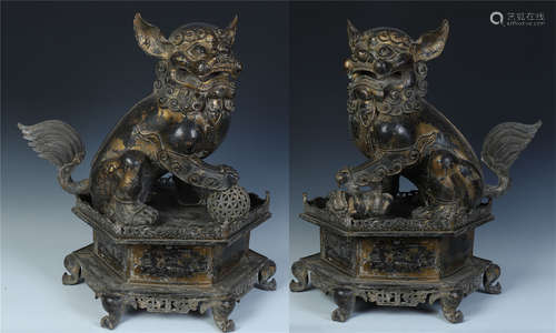 PAIR OF CHINESE GILT BRONZE LIONS WITH BALL ON BASE