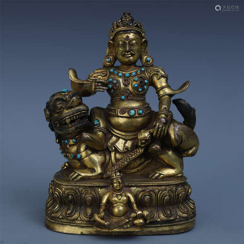 TIBETAN TURQUOISE INLAID GILT BRONZE SEATED GOD OF WEALTH ON LION