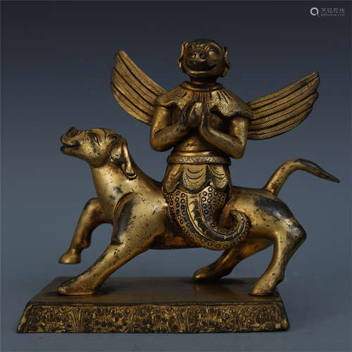 TIBETAN GILT BRONZE BUDDHIST GUARDIAN ON BEAST