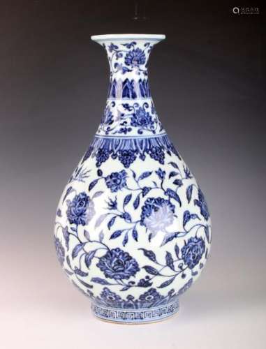 BLUE AND WHITE VASE WITH FLOWERS