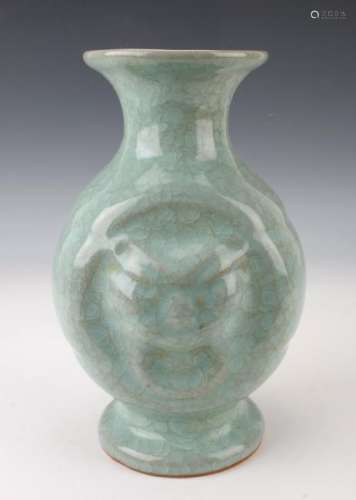 CELADON VASE WITH BAS RELIEF DECORATION ON BODY