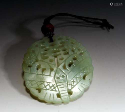 PIERCED AND CARVED JADE PENDANT