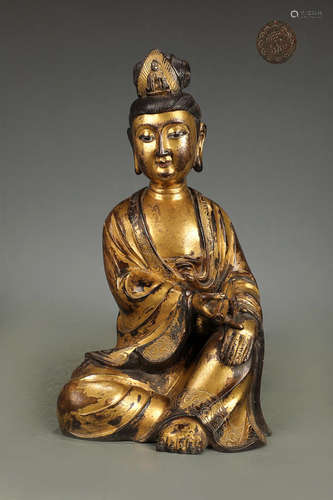 A GILT BRONZE SITTING 