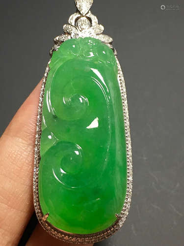 A GREEN JADEITE CARVED 