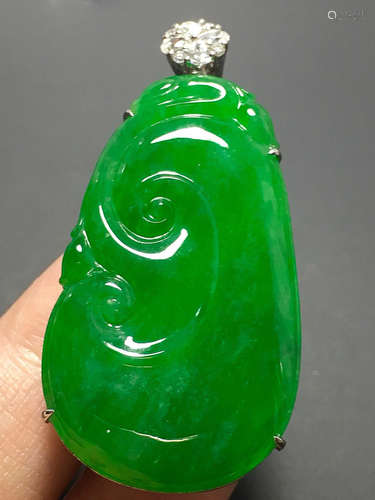 A GREEN JADEITE CARVED 