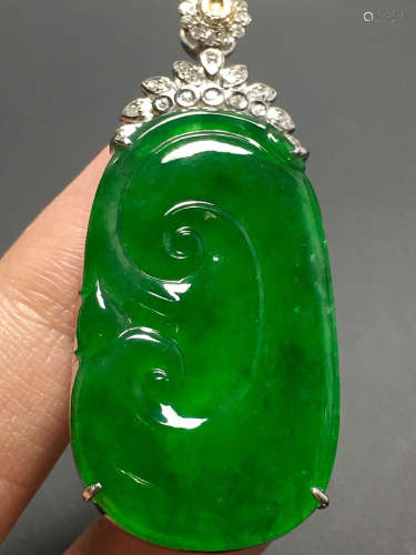 A GREEN JADEITE CARVED 