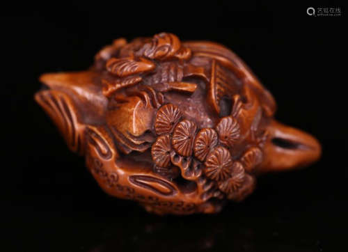 A WALNUT CHARACTER STORY CARVED ORNAMENT