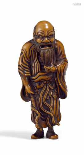 NETSUKE: SENNIN MIT STOCK. Japan. Meiji-Zeit. 19. Jh. Buchsbaum, fein geschnitzt und graviert, teils