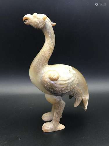 A CARVED JADE PHOENIX .ANTIQUE