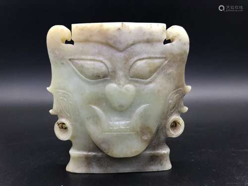 A CARVED JADE MASK.ANTIQUE