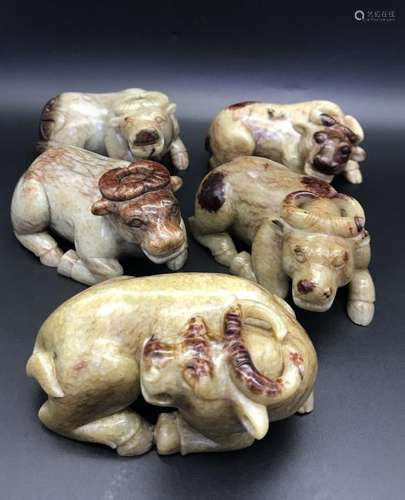 FIVE OF CARVED JADE BUFFALOS.