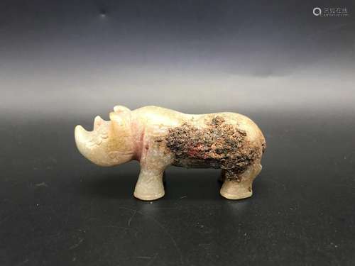 A CARVED JADE RHINOCEROS .ANTIQUE