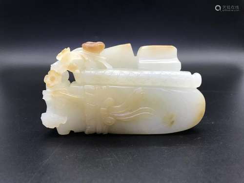 A CARVED WHITE JADE QIN AND BOOK.