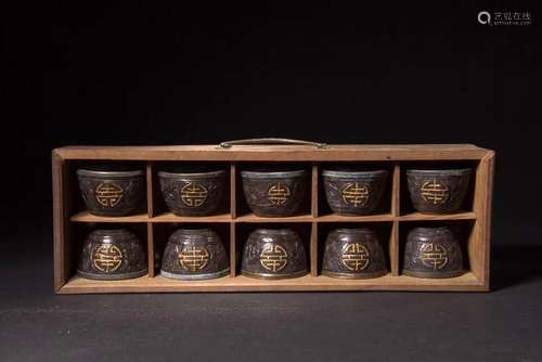 A SET OF TEN CARVED COCONUT SHELL CUPS.QING DYNASTY