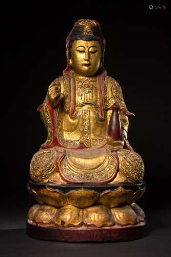 A CARVED-GLITED NANMU CARVING OF GUANYIN.ANTIQUE