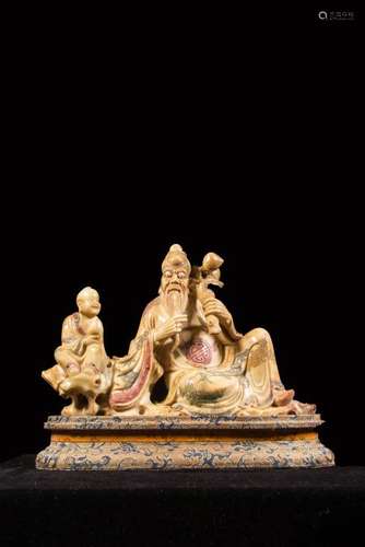 A SOAPSTONE CARVING OF SHOULAO AND ATTENDANT.ANTIQUE