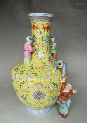 A YELLOW-GROUND FAMILLE-ROSE BOY'S VASE.MARK OF