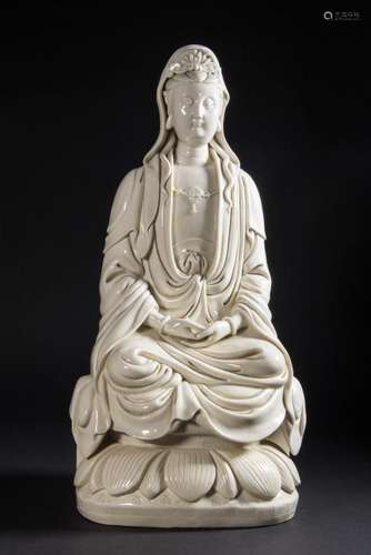 A CARVED DEHUA GUANYIN.