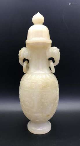 A CARVED WHITE JADE ELEPHANT HEADS VASE AND