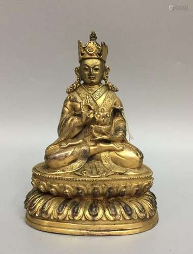 A GILT-BRONZE FIGURE OF PADMASAMBHAVA.QING DYNASTY