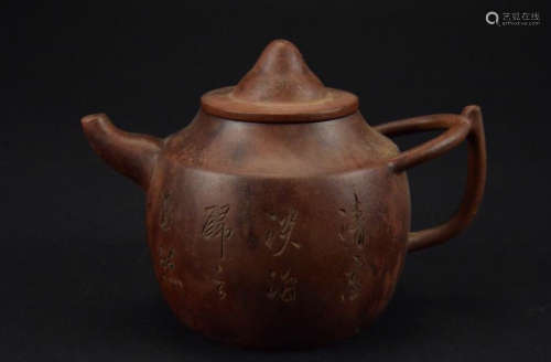 A ZISHA POT WITH POETRY CARVERED