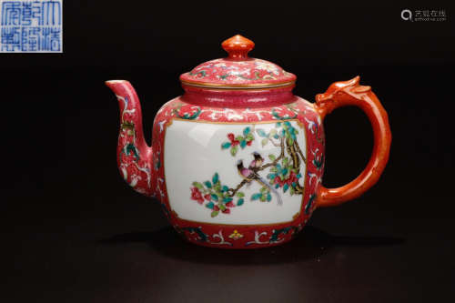 AN ENAMELED TEAPOT OF FLOWERS AND BIRDS WITH QIANLONG MARKING