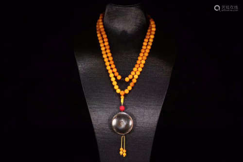 AN AMBER ROSARY OF 108 BEADS WITH DZI