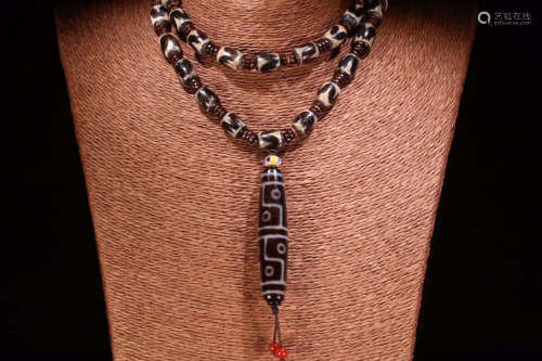 A TWELVE-EYE DZI NECKLACE