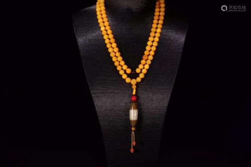 AN AMBER ROSARY OF 108 BEADS