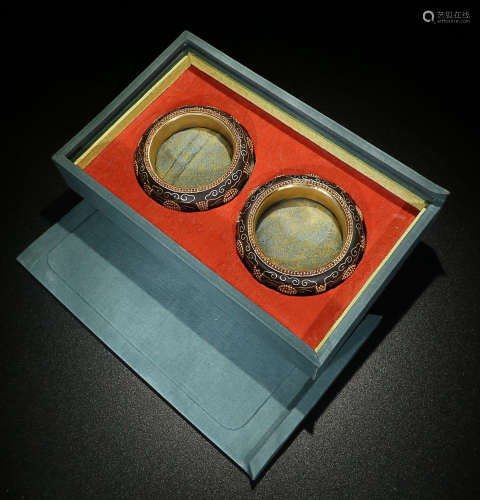 A PAIR OF CHENXIANG WOOD BANGLES WITH SILVVER INLAID