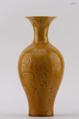 A DING YELLOW GLAZE CARVED VASE