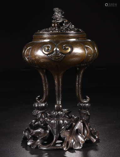 A BRONZE TRIPOD CENSER